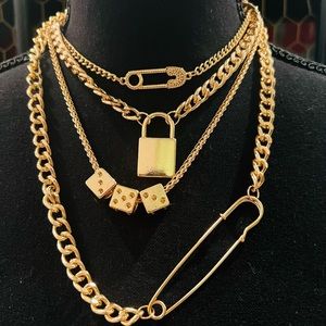 Stunning brand new, never worn gold multi layer, necklace locks and safety pins